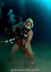 US Navy diver with a small wrench. by Andrew Mckaskle 